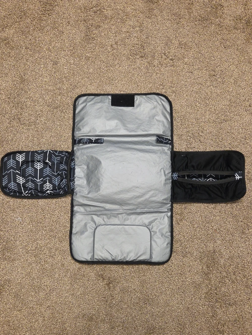 The Carters Black Arrow Fox Baby Mini Diaper Mat & Bag is a stylish and practica
